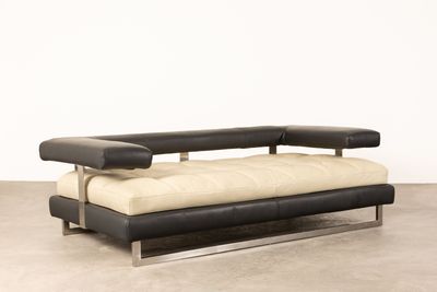 an image of a black and white couch in a room