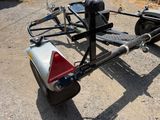 a trailer with a trailer attached to it on the road