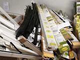 a lot of boxes and umbrellas on the floor