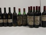 several bottles of wine are lined up in a row on a table
