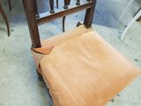 a chair that is sitting on the floor next to a table
