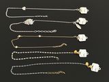a collection of jewellery including a necklace, bracelet, and ring