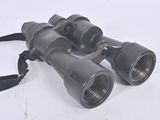 a pair of binoculars sitting on a white surface