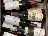 many bottles of wine in a box on the table