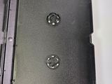 a black plastic box with two screws on it