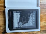 a kindle that is sitting in a box on a table