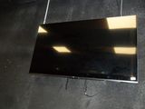 a flat screen tv hanging on the wall in the room
