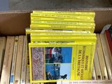 a lot of books in a box on a table