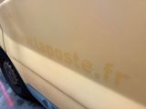 a close up of a yellow van with the word thesteophich on it ' s side