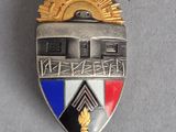 a close up of a badge on a gray surface