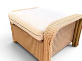 an image of a wicker ottoman with a cushion on top of it