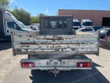 a truck that is parked in a lot with other trucks