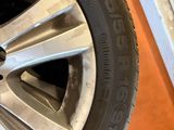 a close up of a tire on a car with a tire wren