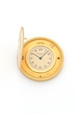 an image of a gold pocket watch on a white background