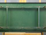 an image of a green easel with a painting on top of it