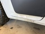 a close up of a car with a tire on the ground