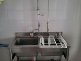 a sink and a dish rack in a kitchen