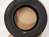 a tire that is sitting on top of a cardboard box