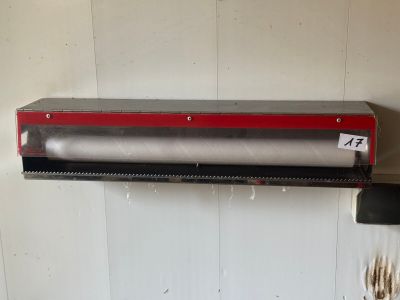 an image of a paper towel dispenser hanging on a wall