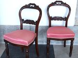 two chairs sitting next to each other on a black and white checkered floor