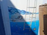 a cardboard box with a ladder on it next to a cardboard box with a ladder on it