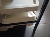a baby high chair with a tray on top of it