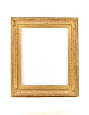 a gold frame on a white wall with a white background