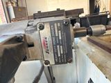 a machine that is working on a piece of metal