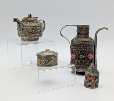 three different types of vases and a teapot on display