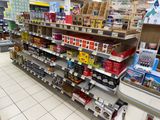 many shelves in the store that have various items on them