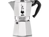 a close up of a stove top coffee maker on a white surface