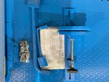 a blue box with a toilet and a toilet paper dispenser in it