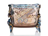 a glass bowl with a dragon design on it