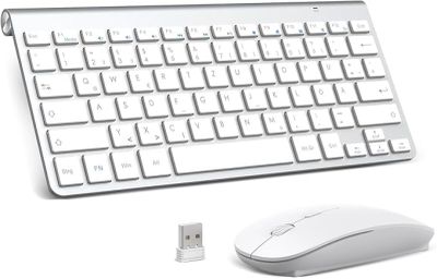 a computer keyboard and mouse sitting next to each other