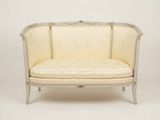 an image of a white couch with a beige upholstered seat
