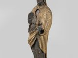 a bronze statue of a man holding a baby