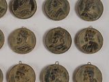 some very pretty old coins that are sitting on a table