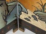 a picture of a room divider with a painting on it
