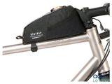 a close up of a bike with a bag on the handlebar