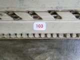 a close up of a metal plate with a number on it