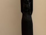 a statue of a woman holding a baby in her arms