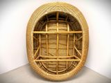 a wicker basket that is sitting on the floor