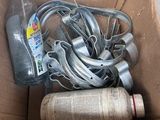 a cardboard box with a bunch of wires and a bottle of water