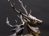 bronze sculpture of a stag and a baby stag