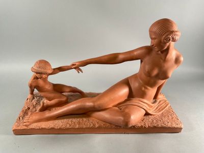 an image of a statue of a woman and a man on a beach