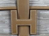 a close up of the handle of a white wicker suitcase