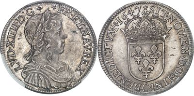 une pièce d'argent surmontée d'une couronne