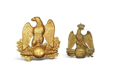 pair of gold eagle figurines on a white background