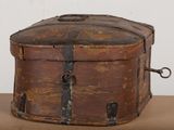 an old wooden box sitting on top of a table