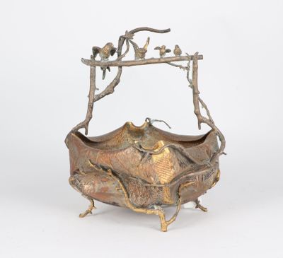 an image of a metal bowl with a bird on it